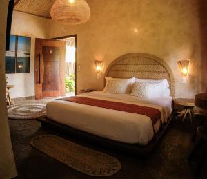 a bedroom with a large bed in a room at Hotel Pousada Rancho das Dunas in Santo Amaro +45 photos