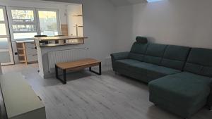 a living room with a couch and a table at Danube House in Cluj-Napoca