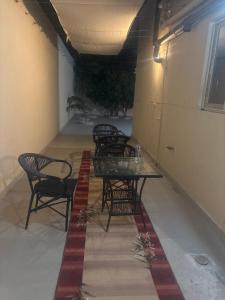 a group of chairs and tables in a room at Dera October city in 6th Of October