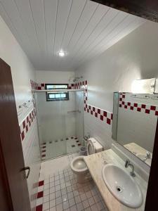 a bathroom with a shower and a sink and a toilet at Pousada Solar D Alcina in Paraty +60 photos