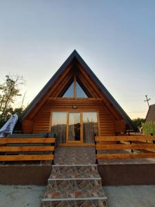 a log cabin with a large window on it at Brvnara kao na dlanu 2 in Rudnik