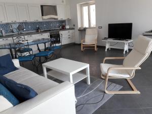 a living room with a couch and a table at Amalfi Coast Emotions in Vietri sul Mare