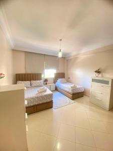 a bedroom with two beds in a room at Hanae malabata in Tangier
