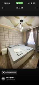 a bedroom with a large bed in a room at Версаль отель in Türkistan +14 photos