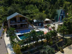 an aerial view of a resort with a swimming pool at Guesthouse kalakala in Batumi