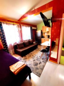 a living room with a couch and a table at 1Центер квартира кондиціонер парковка WiFi in Ivano-Frankivsk +6 photos