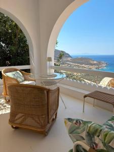 a living room with a view of the ocean at Lobster House Antiparos in Antiparos