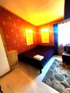 a room with a bed in the corner of a room at 1Центер квартира кондиціонер парковка WiFi in Ivano-Frankivsk