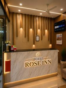 a hotel rose inn lobby with a reception desk at Hotel Rose Inn in Prayagraj