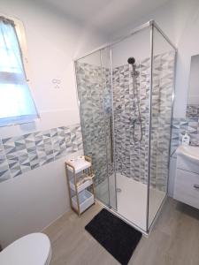 a bathroom with a shower with a toilet and a sink at La Casa di Giovanni B&B in Romano D'Ezzelino