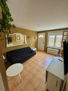 a bedroom with a bed and a table in it at Casa Pont in Osséja