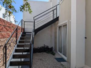 a staircase leading up to the side of a building at Departamento EMPRESARIAL cerca de zona industrial in Chihuahua