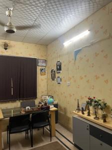 an office with a desk and chairs in a room at Faran inn guest house in Hyderabad