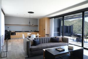 a living room with a couch and a table at Puesto del Indio in Mendoza