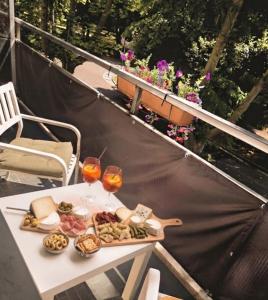 a tray of food on a table on a balcony at Elycon House Bergamo - Locazione turistica a camere in Bergamo