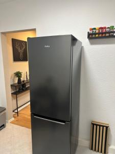 a stainless steel refrigerator in a kitchen at Ferienwohnung zum Buchhellertal in Burbach