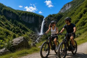 a man and a woman riding bikes down a road with a waterfall at Casa Panorama in Brissago +7 photos