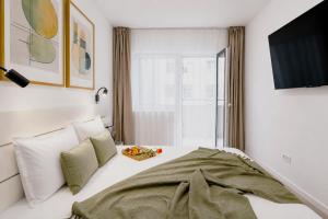 a bedroom with a bed and a window at Sasha Wave Studio in Popeşti-Leordeni +27 photos