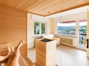 a person with their feet up on the wall of a room at PMC Traumblick Suite & Spa - Whirlpool & Sauna in Bad Ems