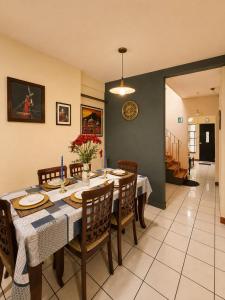 a dining room with a table and chairs at Mazaryk Bed and Breakfast in Antigua Guatemala