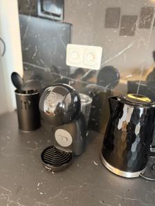 a kitchen counter with a blender and a toaster at Le Cosy in Dunkerque