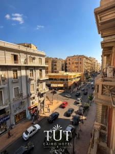 a view of a busy city street with cars parked at TUT Cairo Hotel & Suites in Cairo