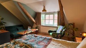 a bedroom with a bed and a table and a window at Turkusowa Wyspa in Wleń +124 photos