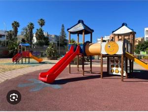 a playground with a slide in a park at Casa Monteserrato in Terrasini