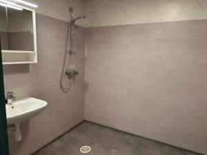 a bathroom with a sink and a shower at Villa Fresvik in Fresvik +63 photos