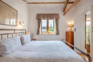 a bedroom with a bed and a window at 1 Bed in Bristol oc-85559 in Langford +39 photos