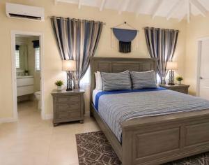 a bedroom with a large bed and two night stands at Apartment in St Ann in Priory +33 photos
