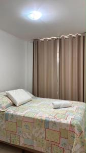 a bed in a room with a curtain and a bed sidx sidx at Prive in Paulista +26 photos