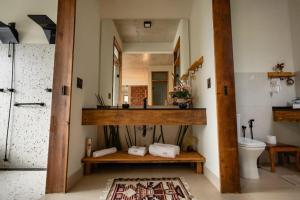 a bathroom with a sink and a mirror at Loft Montclair in Nova Lima +46 photos