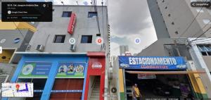 a group of buildings on a city street at Hotel Max Tatuapé in São Paulo