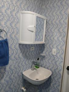 a bathroom with a sink and a mirror at posada nativa NIYKA in Casabaja +18 photos