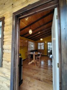 a dining room and living room with a table at Cabaña Santa Rosa in Tecpán Guatemala +47 photos