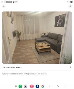 a living room with a couch and a coffee table at Appartement t3 in Saint-Étienne