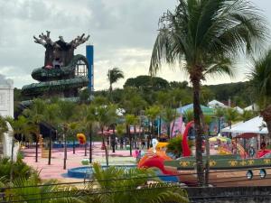 a amusement park with a roller coaster and a water park at Prive in Paulista