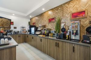 a fast food restaurant with a cash register and a counter at Best Western Plus Dauphin in Dauphin