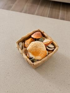 a basket filled with different types of food on a table at Casa Mar by Living & Co in Albufeira