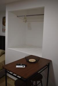 a wooden table with a basket on top of it at Casa dos Avós da Lapa in Lapa dos Dinheiros