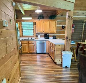 a kitchen with wooden cabinets and a blue refrigerator at Sugar Bear in Sevierville