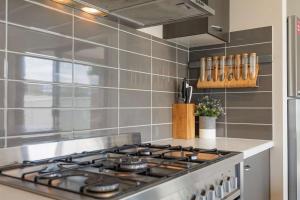 a kitchen with a stove top oven in a kitchen at 28 Skye Ave - Skye High on Style in Moama +15 photos