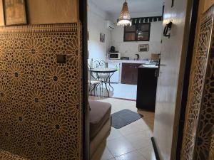 a kitchen and a living room with a kitchenasteryasteryasteryasteryasteryasteryastery at Hobbiton in Agadir