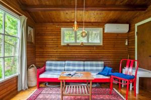a living room with a couch and a table at 2036-Stege-Solvgranen-16 in Stege