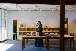a woman standing in front of a table in a store at HOTEL FORK & KNIFE Miyajima in Miyajima +167 photos