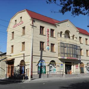 a large white building with a sign on it at DAVID Hotel in Yerevan