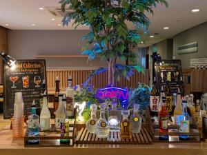 a bar with bottles of alcohol on a table at Super Hotel Morioka in Morioka
