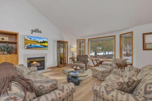 a living room with couches and a fireplace at Mt. St. Helens - Unit 9 in Sunriver