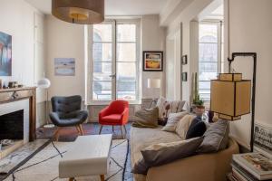 Televizorius ir (arba) pramogų centras apgyvendinimo įstaigoje Le Grand Paris Apartments